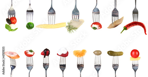 Photo: Collage of food on forks isolated on white Collage of food on forks isolated on white