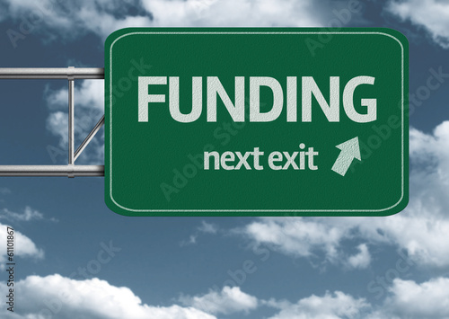 Illustration: Funding, next exit creative road sign and clouds Funding, next exit creative road sign and clouds