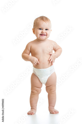 Photo: standing baby girl isolated on white background standing baby girl isolated on white background