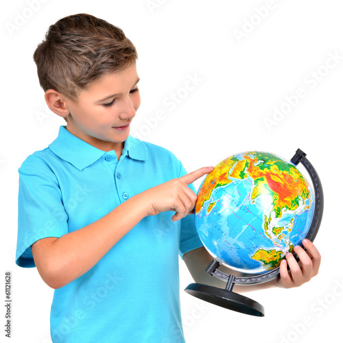 Photo: Smiling boy in casual holding globe Smiling boy in casual holding globe