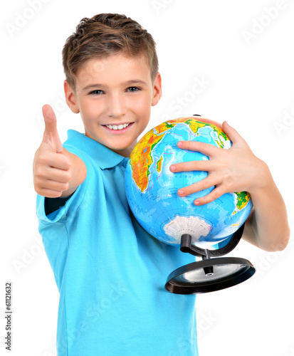 Photo: Smiling boy in casual holding globe with thumbs up Smiling boy in casual holding globe with thumbs up