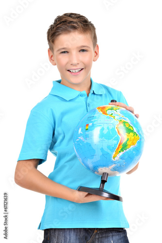 Photo: Smiling boy in casual holding globe in hands Smiling boy in casual holding globe in hands