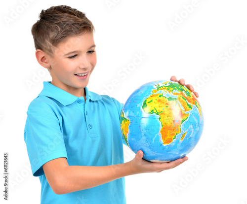 Photo: Smiling boy in casual holding globe in hands Smiling boy in casual holding globe in hands