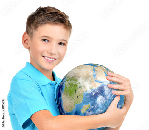 Photo: Smiling boy in casual holding planet earth in hands Smiling boy in casual holding planet earth in hands