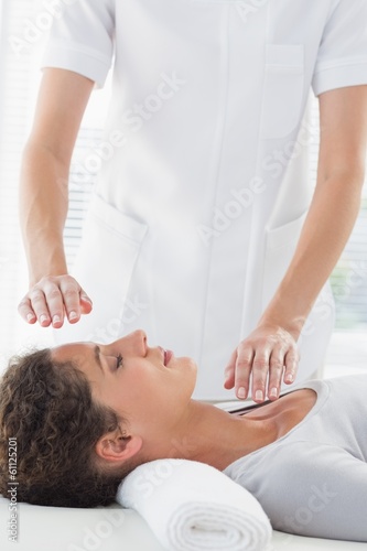 Photo: Woman receiving alternative therapy Woman receiving alternative therapy