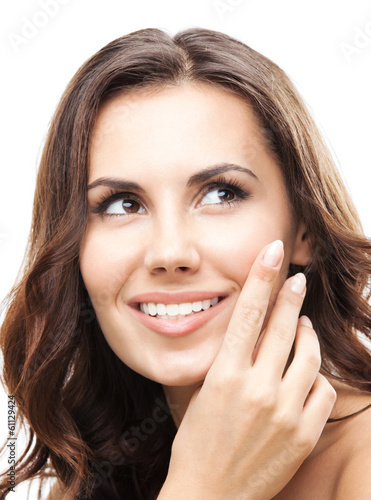 Photo: Woman touching skin or applying cream, isolated Woman touching skin or applying cream, isolated