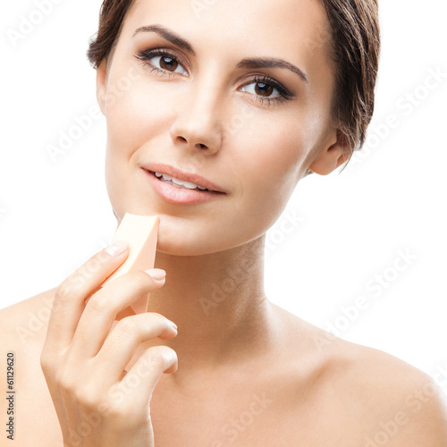 Photo: Young woman cleaning skin by cotton pad Young woman cleaning skin by cotton pad
