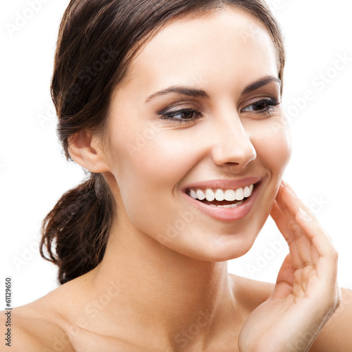 Photo: Woman touching skin or applying cream, isolated Woman touching skin or applying cream, isolated