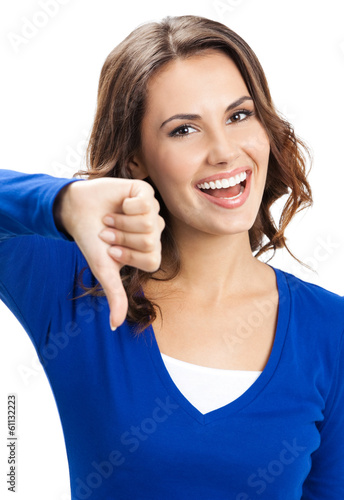 Photo: Woman showing thumbs down gesture, isolated Woman showing thumbs down gesture, isolated