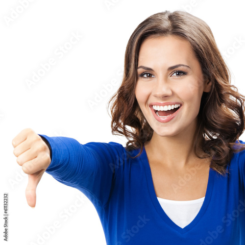 Photo: Woman showing thumbs down gesture, isolated Woman showing thumbs down gesture, isolated