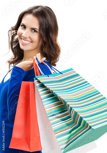 Photo: Young happy woman with shopping bags, isolated Young happy woman with shopping bags, isolated