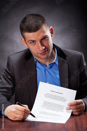Photo: Crook holding an agreement Crook holding an agreement