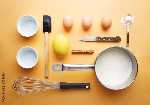 Photo: Creme brulee ingredients on yellow background Creme brulee ingredients on yellow background