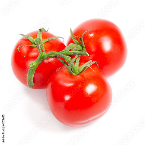 Photo: Fresh tomatoes isolated on white Fresh tomatoes isolated on white