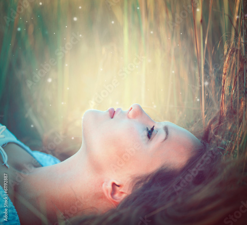 Photo: Teenage model girl outdoors enjoying nature Teenage model girl outdoors enjoying nature