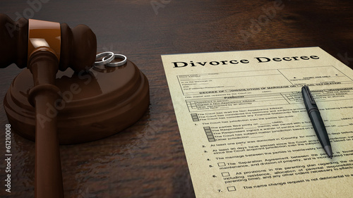 Photo: divorce decree paper with a pen, gavel and rings divorce decree paper with a pen, gavel and rings