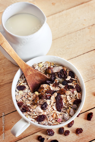 Photo: healthy breakfast background/ bowl of oat flake with raisins healthy breakfast background/ bowl of oat flake with raisins