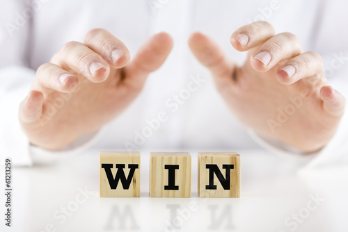 Photo: The word - Win - on wooden blocks The word - Win - on wooden blocks