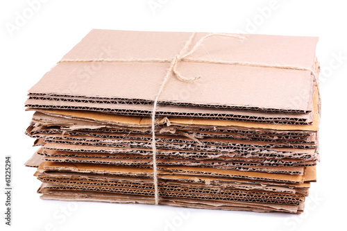Photo: Stack of cardboard for recycling isolated on white Stack of cardboard for recycling isolated on white
