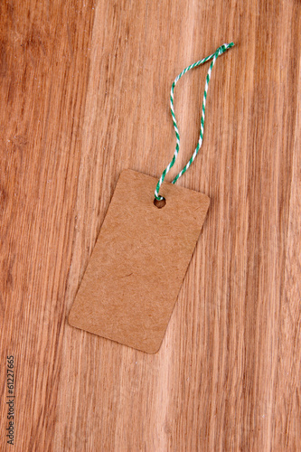 Photo: Set of tags on color wooden background Set of tags on color wooden background