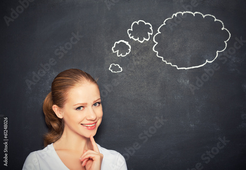Photo: woman think at blank blackboard woman think at blank blackboard