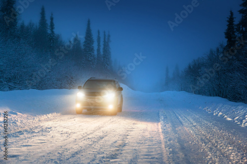Photo: Car lights in winter Russian forest Car lights in winter Russian forest