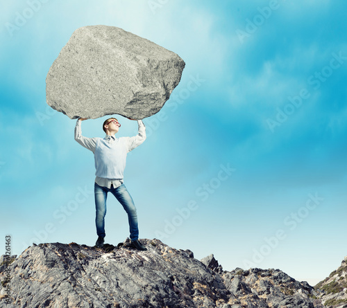 Photo: Guy lifting stone Guy lifting stone