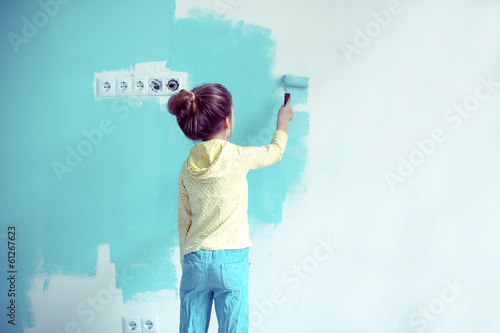 Photo: Child painting the wall Child painting the wall