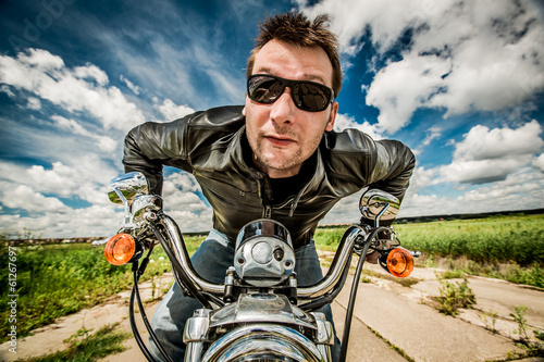 Photo: Biker racing on the road Biker racing on the road