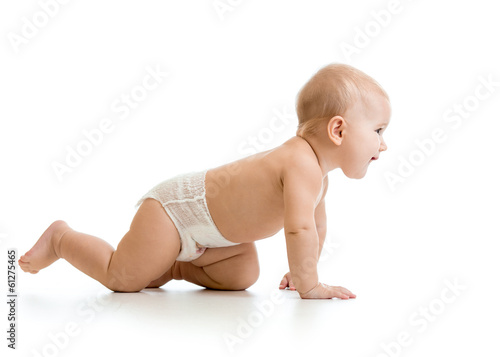 Photo: side view of pretty crawling baby girl side view of pretty crawling baby girl