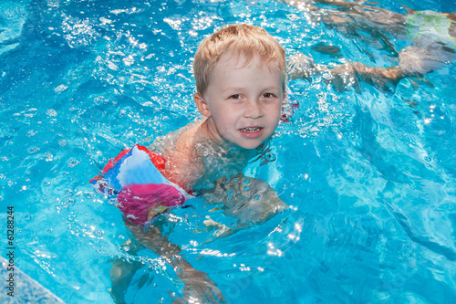 Photo: Boy swims in the pool Boy swims in the pool