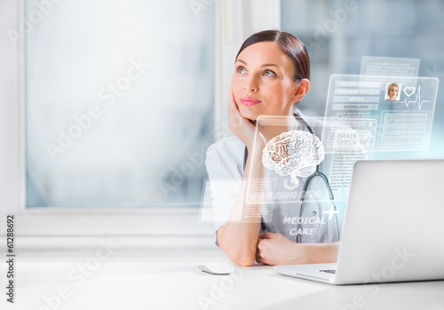 Photo: Female doctor scanning brain of patient with help of modern tech Female doctor scanning brain of patient with help of modern tech