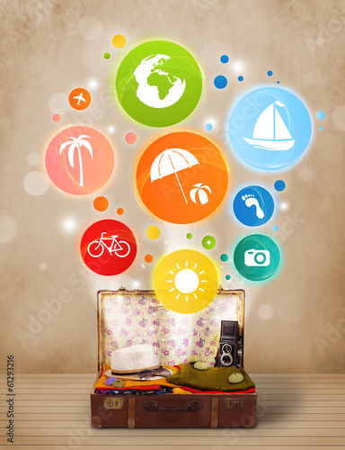 Photo: Suitcase with colorful summer icons and symbols Suitcase with colorful summer icons and symbols