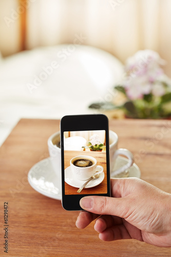 Photo: Smartphone taking picture of coffee Smartphone taking picture of coffee