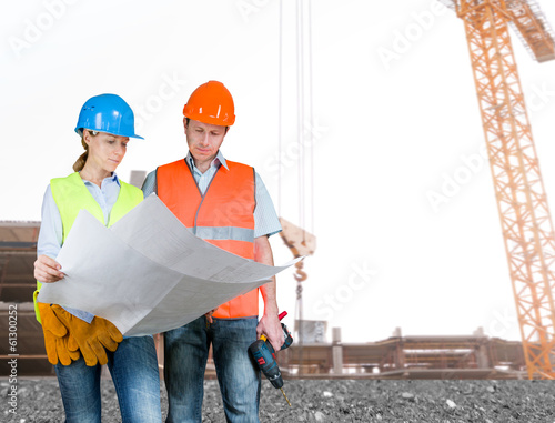 Photo: Foreman and engineer with blueprints Foreman and engineer with blueprints