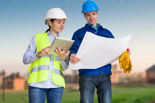 Photo: Foreman and student with blueprints Foreman and student with blueprints