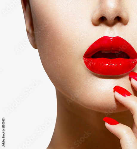 Photo: Red Sexy Lips and Nails closeup. Manicure and Makeup Red Sexy Lips and Nails closeup. Manicure and Makeup