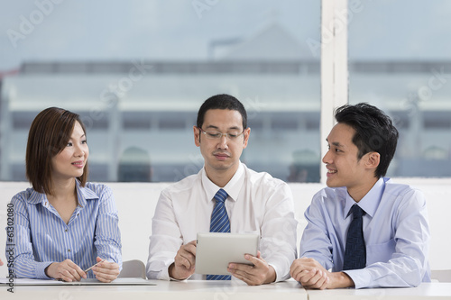 Photo: Business team working together Business team working together