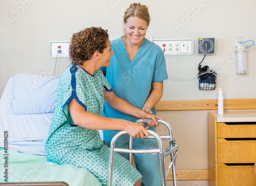 Photo: Nurse Assisting Patient Using Walking Frame In Hospital Nurse Assisting Patient Using Walking Frame In Hospital