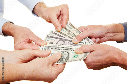 Photo: Many hands of senior people holding money Many hands of senior people holding money