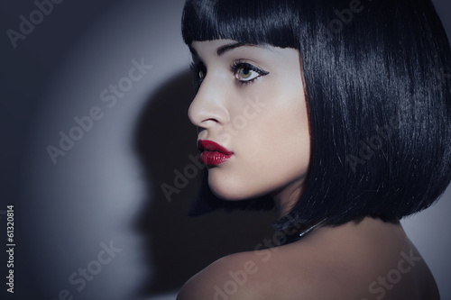 Photo: Beautiful Brunette Woman.Retro Haircut.Red lips.Beauty & Fashion Beautiful Brunette Woman.Retro Haircut.Red lips.Beauty & Fashion