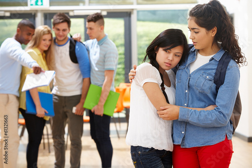 Photo: Friend Comforting Victim Of Bullying At School Friend Comforting Victim Of Bullying At School