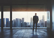 Businessman looking at city Businessman looking at city