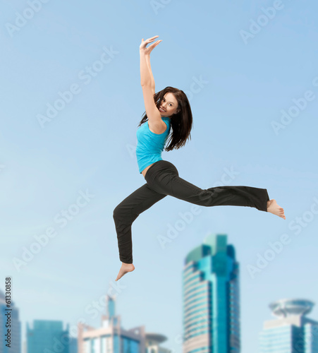 Photo: sporty woman jumping in sportswear sporty woman jumping in sportswear
