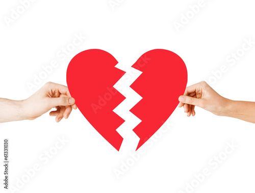 Photo: hands holding broken heart hands holding broken heart