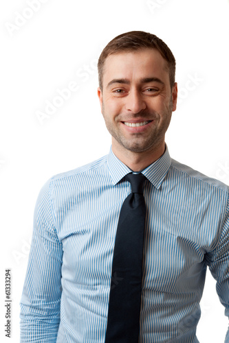 Photo: Happy smiling mature business male in blue shirt tie on white ba Happy smiling mature business male in blue shirt tie on white ba