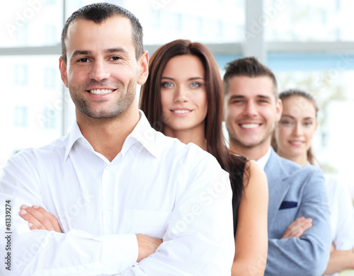 Photo: business team standing in a row at office business team standing in a row at office