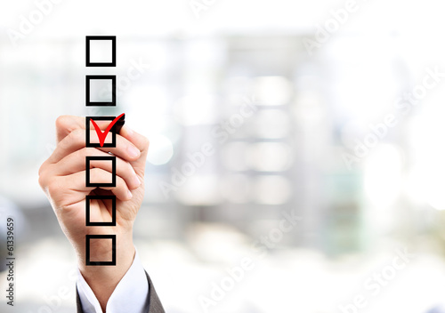 Photo: Hand choosing one of the options Hand choosing one of the options