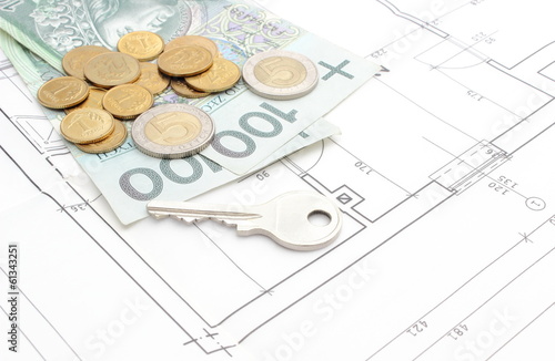 Photo: Money and silver key lying on the housing plan Money and silver key lying on the housing plan