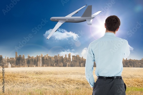 Photo: Composite image of thoughtful businessman with hand on chin Composite image of thoughtful businessman with hand on chin